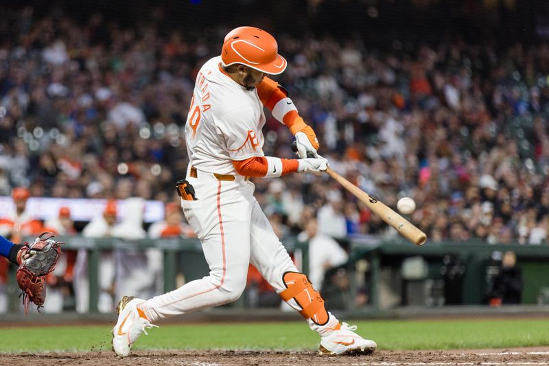 Jun 25, 2024; San Francisco, California, USA; San Francisco Giants second baseman Thairo Estrada (39) hits a single against the Chicago Cubs during the seventh inning at Oracle Park. Mandatory Credit: John Hefti-USA TODAY Sports