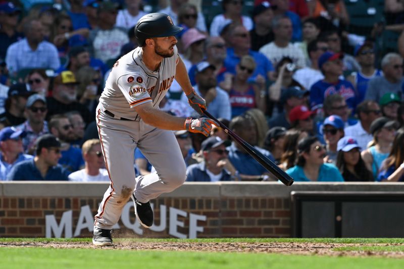 Sep 6, 2023; Chicago, Illinois, USA;  San Francisco Giants shortstop Paul DeJong (18) singles against the Chicago Cubs during the seventh inning at Wrigley Field. Mandatory Credit: Matt Marton-USA TODAY Sports