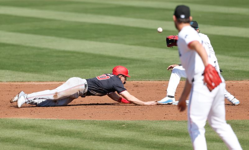 Feb 25, 2024; Jupiter, Florida, USA; Miami Marlins relief pitcher Anthony Bender (37) picks off Washington Nationals outfielder Jacob Young (30) in the third inning at Roger Dean Chevrolet Stadium. Mandatory Credit: Rhona Wise-USA TODAY Sports