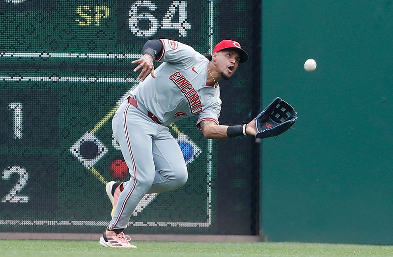 Aug 25, 2024; Pittsburgh, Pennsylvania, USA;  Cincinnati Reds right fielder Santiago Espinal (4) makes a catch for an out against Pittsburgh Pirates right fielder Bryan De La Cruz (not pictured) during the sixth inning at PNC Park. Mandatory Credit: Charles LeClaire-USA TODAY Sports