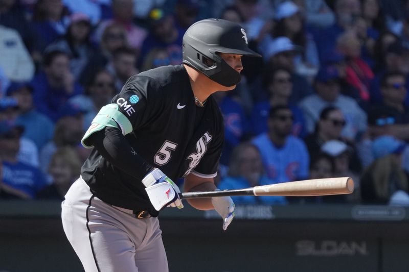 Feb 20, 2026; Mesa, Arizona, USA; Chicago White Sox third baseman Munetaka Murakami (5) hits a single against the Chicago Cubs in the third inning at Sloan Park. Mandatory Credit: Rick Scuteri-Imagn Images