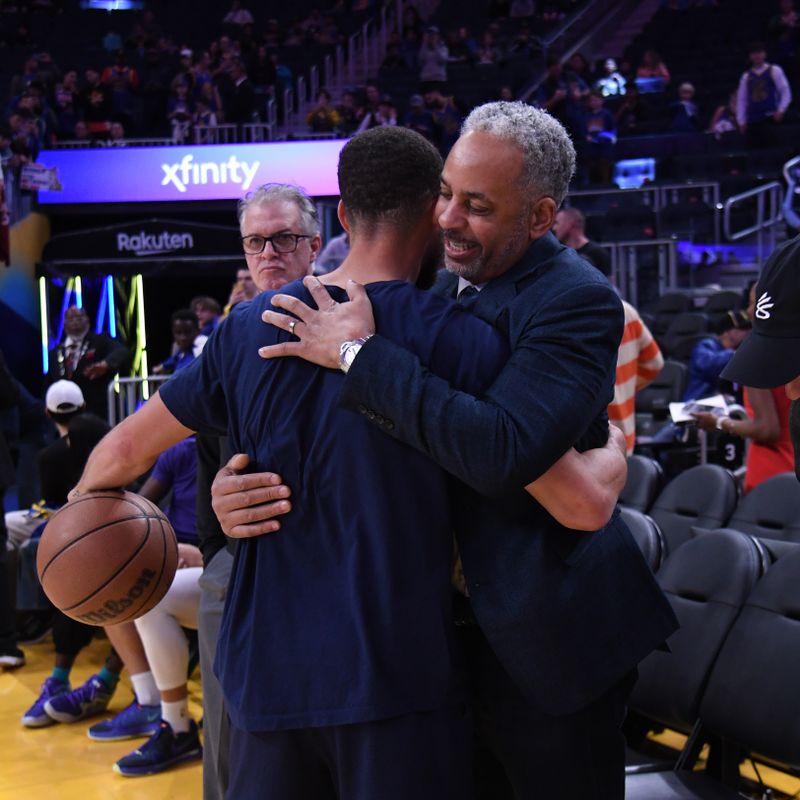 SAN FRANCISCO, CA - FEBRUARY 23: Stephen Curry #30 of the Golden State Warriors talks to Dell Curry before the game against the Charlotte Hornets on February 23, 2024 at Chase Center in San Francisco, California. NOTE TO USER: User expressly acknowledges and agrees that, by downloading and or using this photograph, user is consenting to the terms and conditions of Getty Images License Agreement. Mandatory Copyright Notice: Copyright 2024 NBAE (Photo by Noah Graham/NBAE via Getty Images)