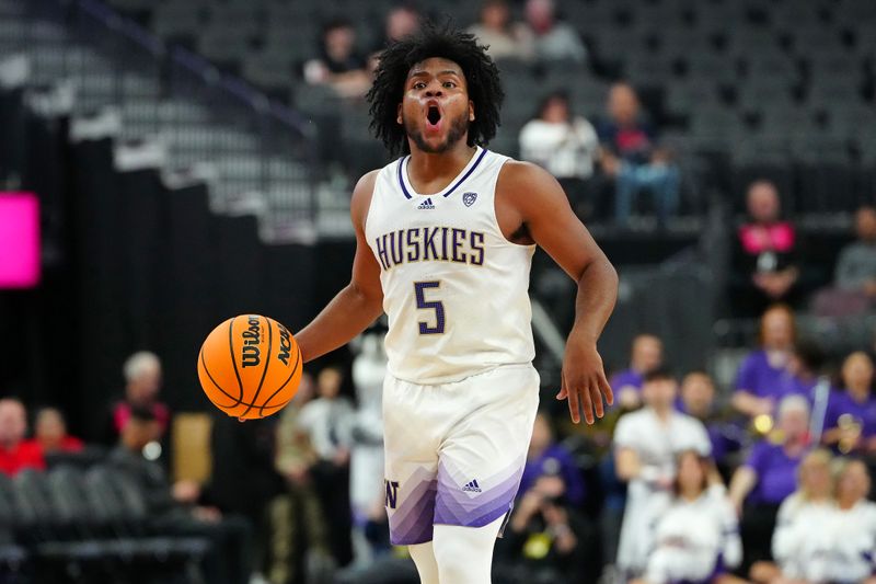 Mar 13, 2024; Las Vegas, NV, USA; Washington Huskies guard Sahvir Wheeler (5) dribbles against the USC Trojans during the first half at T-Mobile Arena. Mandatory Credit: Stephen R. Sylvanie-USA TODAY Sports