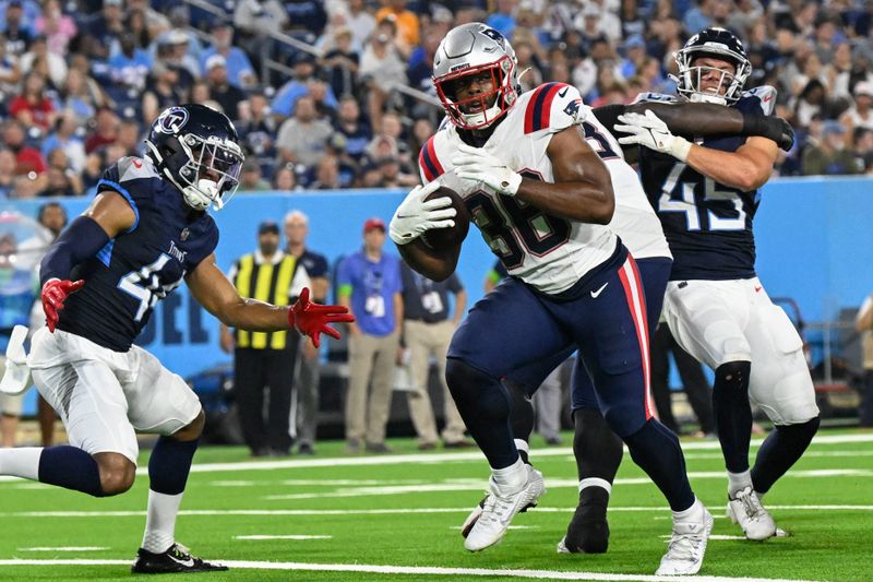 New England Patriots running back Kevin Harris (36) carries for a touchdown between Tennessee Titans safety Mike Brown (44) and linebacker Chance Campbell (45) in the first half of an NFL preseason football game against the Tennessee Titans Friday, Aug. 25, 2023, in Nashville, Tenn. (AP Photo/John Amis)