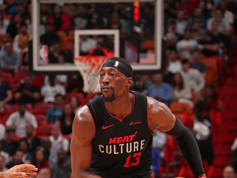 MIAMI, FL - APRIL 10: Bam Adebayo #13 of the Miami Heat handles the ball during the game against the Dallas Mavericks  on April 10, 2024 at Kaseya Center in Miami, Florida. NOTE TO USER: User expressly acknowledges and agrees that, by downloading and or using this Photograph, user is consenting to the terms and conditions of the Getty Images License Agreement. Mandatory Copyright Notice: Copyright 2024 NBAE (Photo by Issac Baldizon/NBAE via Getty Images)