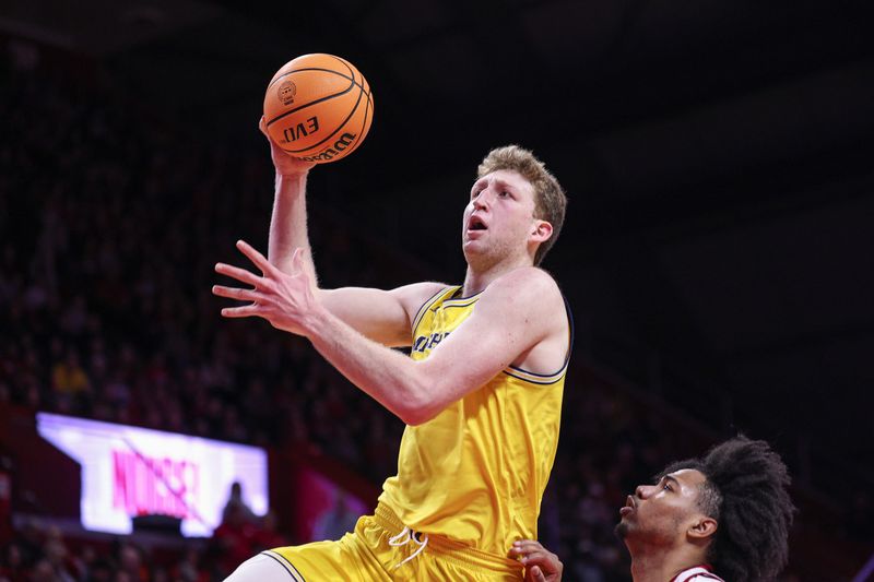 Feb 1, 2025; Piscataway, New Jersey, USA; Michigan Wolverines center Danny Wolf (1) drives to the basket against Rutgers Scarlet Knights center Lathan Sommerville (24) during the first half at Jersey Mike's Arena. Mandatory Credit: Vincent Carchietta-Imagn Images