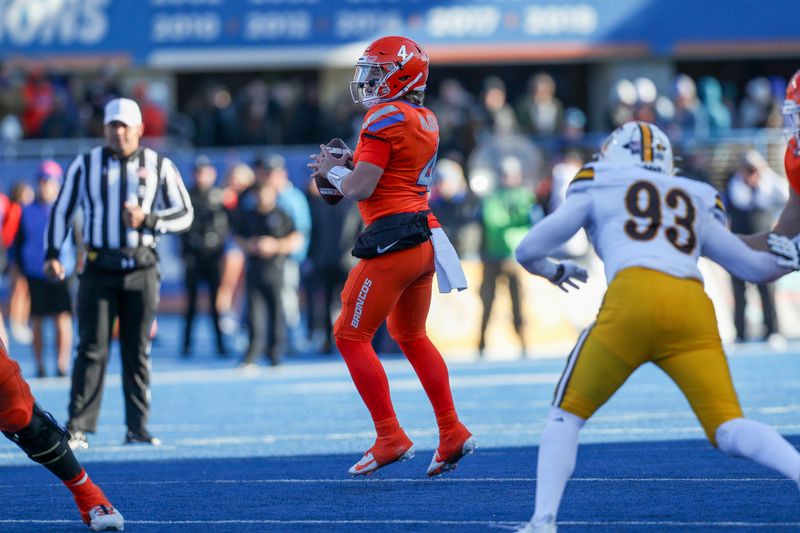 Oct 28, 2023; Boise, Idaho, USA; Boise State Broncos quarterback Maddux Madsen (4) in action during the first half against the against the Wyoming Cowboys at Albertsons Stadium. Mandatory Credit: Brian Losness-USA TODAY Sports

