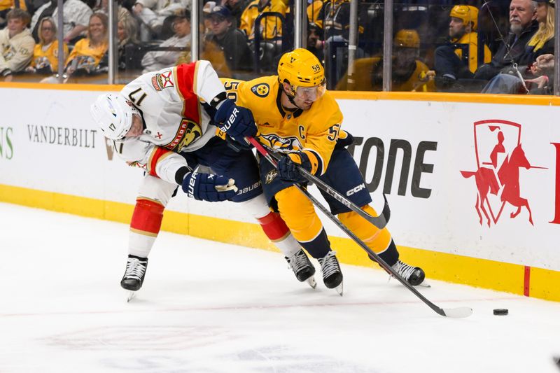 Feb 25, 2025; Nashville, Tennessee, USA;  Nashville Predators defenseman Roman Josi (59) and Florida Panthers center Evan Rodrigues (17) battle for the puck during the second period at Bridgestone Arena. Mandatory Credit: Steve Roberts-Imagn Images