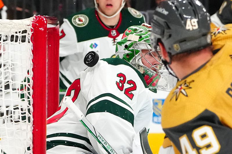 Feb 12, 2024; Las Vegas, Nevada, USA; The Vegas Golden Knights right wing Jonathan Marchessault (81) scores a goal behind the shoulder of Minnesota Wild goaltender Filip Gustavsson (32) during the first period at T-Mobile Arena. Mandatory Credit: Stephen R. Sylvanie-USA TODAY Sports