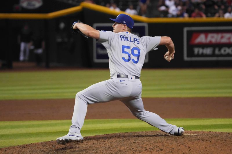 Aug 8, 2023; Phoenix, Arizona, USA; Los Angeles Dodgers relief pitcher Evan Phillips (59) pitches against the Arizona Diamondbacks during the ninth inning at Chase Field. Mandatory Credit: Joe Camporeale-USA TODAY Sports
