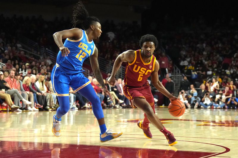 Jan 27, 2024; Los Angeles, California, USA; Southern California Trojans guard Bronny James (6) dribbles the ball against UCLA Bruins guard Sebastian Mack (12) in the second half at Galen Center. Mandatory Credit: Kirby Lee-USA TODAY Sports