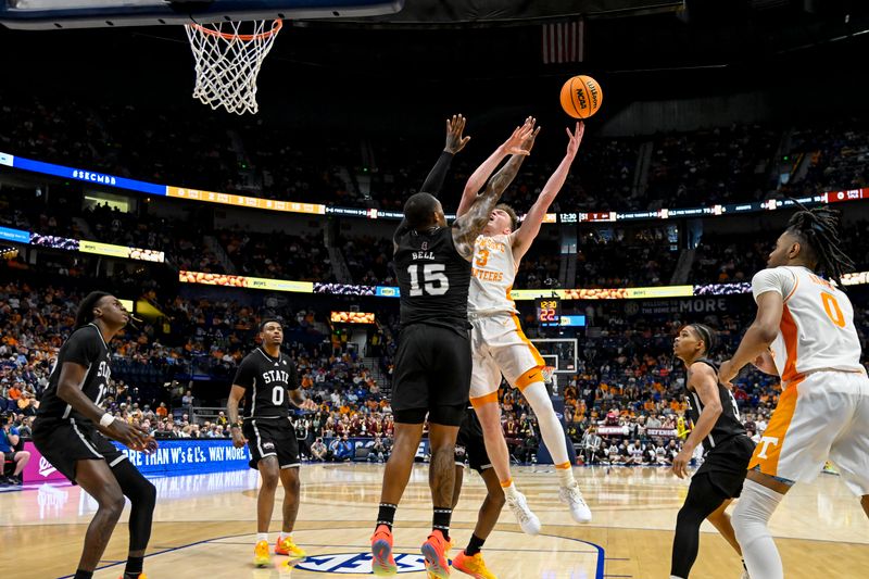 Mar 15, 2024; Nashville, TN, USA; Tennessee Volunteers guard Dalton Knecht (3) shoots over Mississippi State Bulldogs forward Jimmy Bell Jr. (15) during the second half at Bridgestone Arena. Mandatory Credit: Steve Roberts-USA TODAY Sports