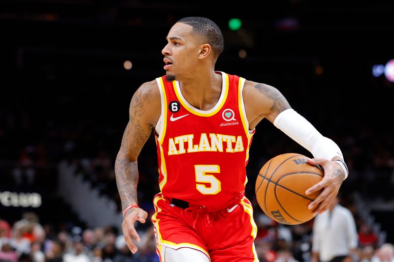 ATLANTA, GA - MARCH 03: Dejounte Murray #5 of the Atlanta Hawks looks to pass during the second half against the Portland Trail Blazers at State Farm Arena on March 3, 2023 in Atlanta, Georgia. NOTE TO USER: User expressly acknowledges and agrees that, by downloading and or using this photograph, User is consenting to the terms and conditions of the Getty Images License Agreement. (Photo by Todd Kirkland/Getty Images)