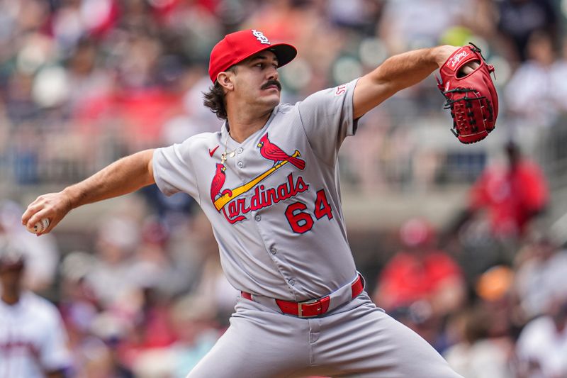 Apr 23, 2025; Cumberland, Georgia, USA; St. Louis Cardinals pitcher Ryan Fernandez (64) pitches against the Atlanta Braves during the eighth inning at Truist Park. Mandatory Credit: Dale Zanine-Imagn Images