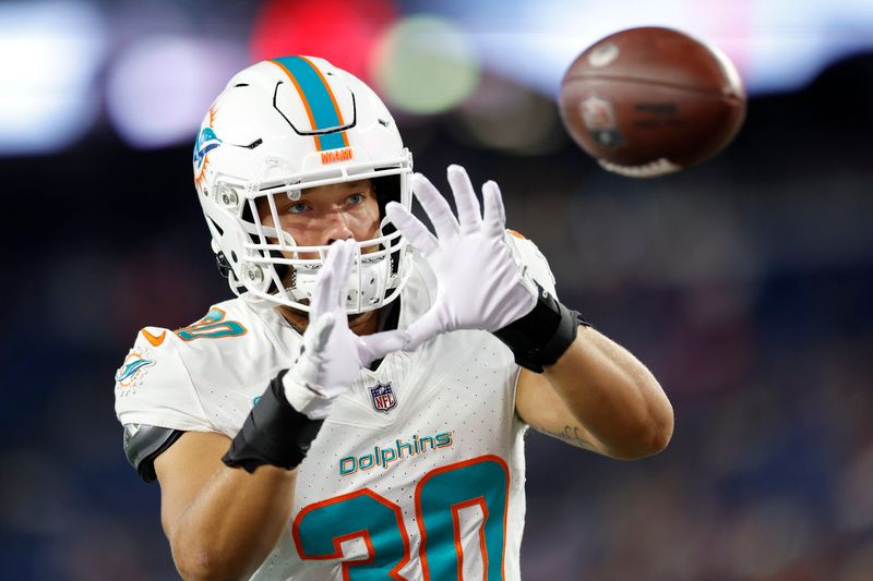 Miami Dolphins fullback Alec Ingold (30) makes a catch before an NFL football game against the New England Patriots on Sunday, Sept. 17, 2023, in Foxborough, Mass. (AP Photo/Greg M. Cooper)