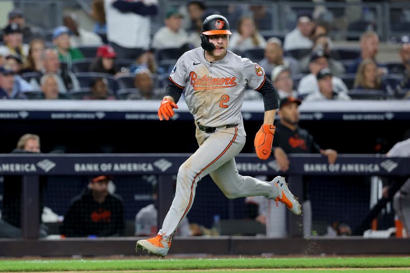 Sep 25, 2024; Bronx, New York, USA; Baltimore Orioles shortstop Gunnar Henderson (2) scores a run against the New York Yankees on a double by right fielder Anthony Santander (not pictured) during the fourth inning at Yankee Stadium. Mandatory Credit: Brad Penner-Imagn Images