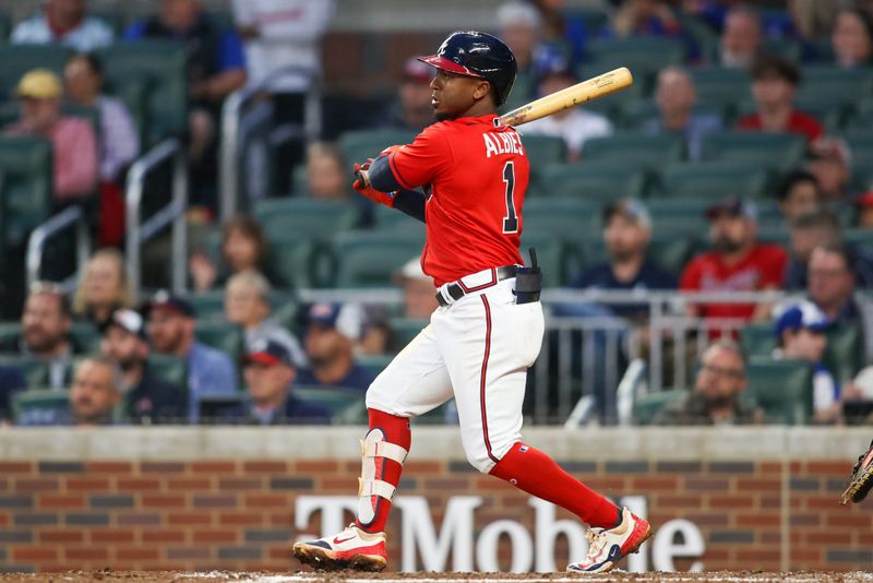 May 5, 2023; Atlanta, Georgia, USA; Atlanta Braves second baseman Ozzie Albies (1) hits a single against the Baltimore Orioles in the fourth inning at Truist Park. Mandatory Credit: Brett Davis-USA TODAY Sports