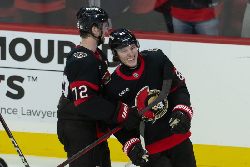 Oct 29, 2024; Ottawa, Ontario, CAN; Ottawa Senators right wing Adam Gaudette (81) celebrates with defenseman Thomas Chabot (72) his goal scored in the third period against the  St. Louis Blues at the Canadian Tire Centre. Mandatory Credit: Marc DesRosiers-Imagn Images