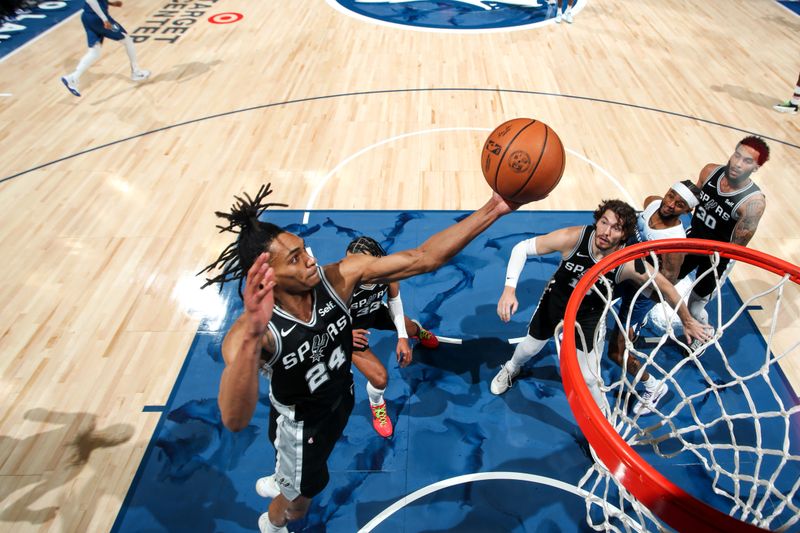 MINNEAPOLIS, MN -  FEBRUARY 27: Devin Vassell #24 of the San Antonio Spurs goes up for the rebound during the game against the Minnesota Timberwolves on February 27, 2024 at Target Center in Minneapolis, Minnesota. NOTE TO USER: User expressly acknowledges and agrees that, by downloading and or using this Photograph, user is consenting to the terms and conditions of the Getty Images License Agreement. Mandatory Copyright Notice: Copyright 2024 NBAE (Photo by Jordan Johnson/NBAE via Getty Images)