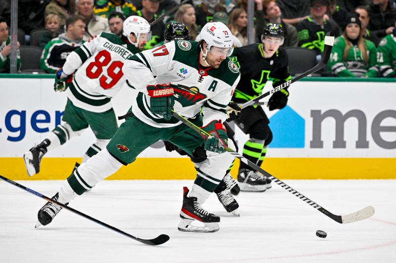 Jan 10, 2024; Dallas, Texas, USA; Minnesota Wild left wing Marcus Foligno (17) skates against the Dallas Stars in the Stars zone during the first period at the American Airlines Center. Mandatory Credit: Jerome Miron-USA TODAY Sports