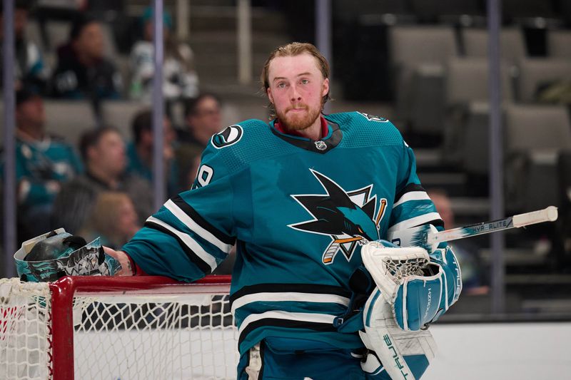 Dec 12, 2023; San Jose, California, USA; San Jose Sharks goaltender Mackenzie Blackwood (29) stands in the goal crease with his helmet off during a timeout against the Winnipeg Jets in the third period at SAP Center at San Jose. Mandatory Credit: Robert Edwards-USA TODAY Sports