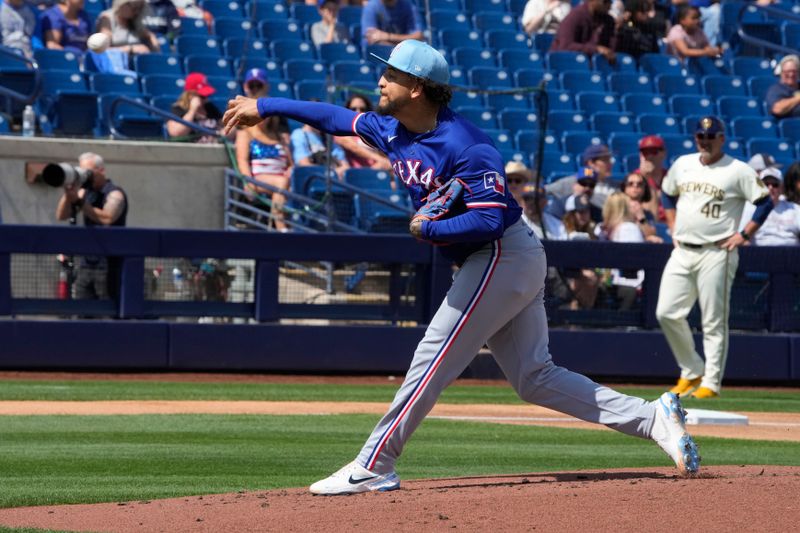 Mar 16, 2024; Phoenix, Arizona, USA; Texas Rangers relief pitcher Yerry Rodriguez (57) throws against the Milwaukee Brewers in the first inning at American Family Fields of Phoenix. Mandatory Credit: Rick Scuteri-USA TODAY Sports