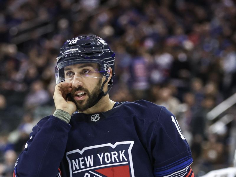 Oct 24, 2024; New York, New York, USA;  New York Rangers center Vincent Trocheck (16) talks with a teammate prior to a faceoff in the third period against the Florida Panthers at Madison Square Garden. Mandatory Credit: Wendell Cruz-Imagn Images