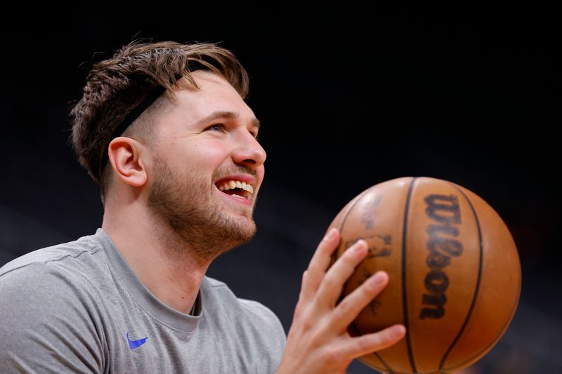 ATLANTA, GEORGIA - JANUARY 26: Luka Doncic #77 of the Dallas Mavericks warms up prior to the game against the Atlanta Hawks at State Farm Arena on January 26, 2024 in Atlanta, Georgia. NOTE TO USER: User expressly acknowledges and agrees that, by downloading and or using this photograph, User is consenting to the terms and conditions of the Getty Images License Agreement. (Photo by Todd Kirkland/Getty Images)