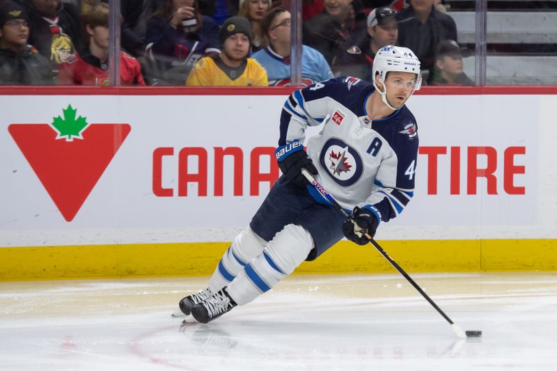 Jan 20, 2024; Ottawa, Ontario, CAN; Winnipeg Jets defenseman Josh Morrissey (44) skates with the puck in the first period against the Ottawa Senators at the Canadian Tire Centre. Mandatory Credit: Marc DesRosiers-USA TODAY Sports