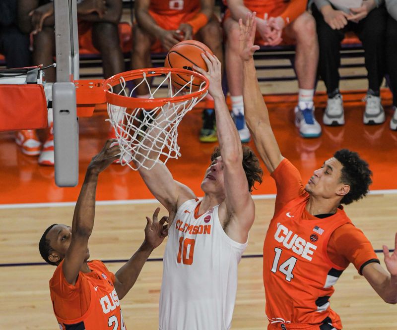 Feb 22, 2023; Clemson, South Carolina, USA; Clemson sophomore forward Ben Middlebrooks (10) shoots against Syracuse center Jesse Edwards (14) during the first half at Littlejohn Coliseum. Mandatory Credit: Ken Ruinard-USA TODAY Sports