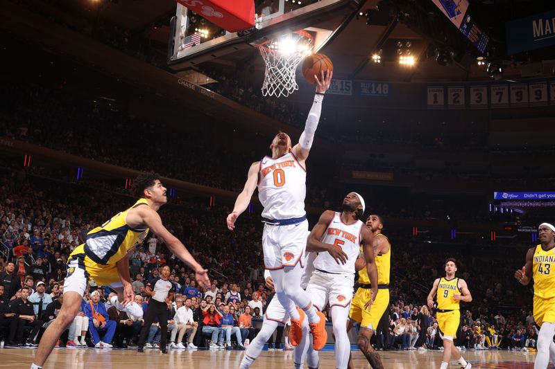 NEW YORK, NY - MAY 19: Donte Divincenzo #0 of the New York Knicks drives to the basket during the game  against the Indiana Pacers during Round 2 Game 7 of the 2024 NBA Playoffs on May 19, 2024 at Madison Square Garden in New York City, New York.  NOTE TO USER: User expressly acknowledges and agrees that, by downloading and or using this photograph, User is consenting to the terms and conditions of the Getty Images License Agreement. Mandatory Copyright Notice: Copyright 2024 NBAE  (Photo by Nathaniel S. Butler/NBAE via Getty Images)