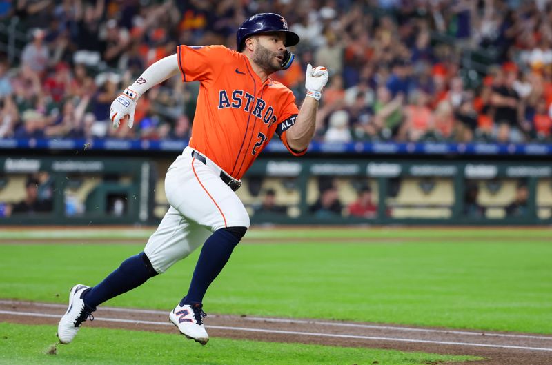 Sep 6, 2024; Houston, Texas, USA;   Houston Astros second baseman Jose Altuve (27) hits a stand up double against the Arizona Diamondbacks in the first inning at Minute Maid Park. Mandatory Credit: Thomas Shea-Imagn Images