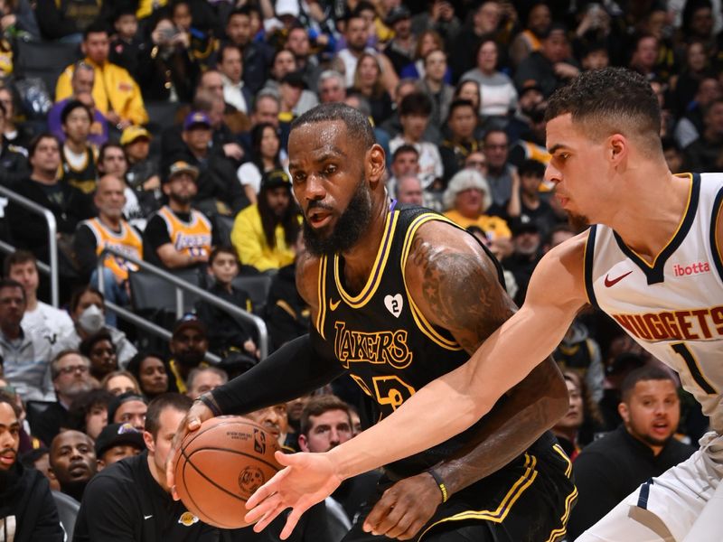 LOS ANGELES, CA - FEBRUARY 8: LeBron James #23 of the Los Angeles Lakers dribbles the ball during the game against the Denver Nuggets on Feburary 8, 2024 at Crypto.Com Arena in Los Angeles, California. NOTE TO USER: User expressly acknowledges and agrees that, by downloading and/or using this Photograph, user is consenting to the terms and conditions of the Getty Images License Agreement. Mandatory Copyright Notice: Copyright 2024 NBAE (Photo by Andrew D. Bernstein/NBAE via Getty Images)