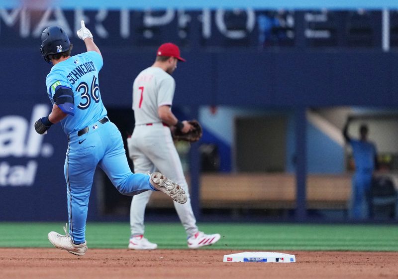 Jun 3, 2025; Toronto, Ontario, CAN; Toronto Blue Jays left fielder Davis Schneider (36) celebrates and runs the bases after hitting a home run against the Philadelphia Phillies during the fifth inning at Rogers Centre. Mandatory Credit: Nick Turchiaro-Imagn Images