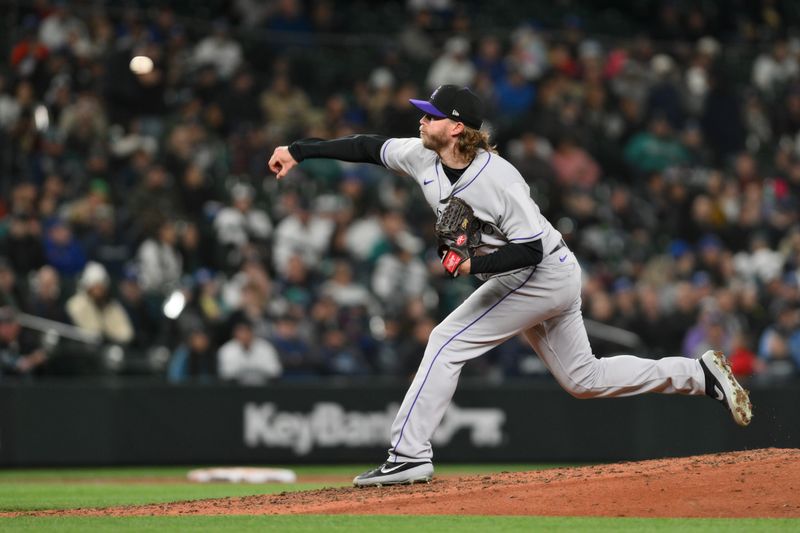 Apr 15, 2023; Seattle, Washington, USA; Colorado Rockies relief pitcher Pierce Johnson (36) pitches against the Seattle Mariners during the eighth inning at T-Mobile Park. Mandatory Credit: Steven Bisig-USA TODAY Sports