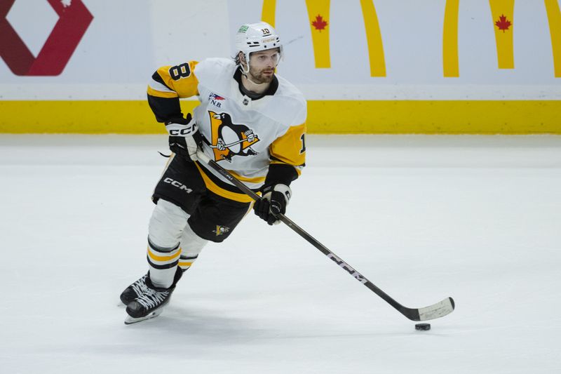 Mar 26, 2026; Ottawa, Ontario, CAN; Pittsburgh Penguins center Thomas Novak (18) skates with the puck in overtime against the Ottawa Senators at the Canadian Tire Centre. Mandatory Credit: Marc DesRosiers-IMAGN Images