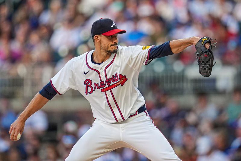 May 15, 2024; Cumberland, Georgia, USA; Atlanta Braves starting pitcher Charlie Morton (50) pitches against the Chicago Cubs during the first inning at Truist Park. Mandatory Credit: Dale Zanine-USA TODAY Sports