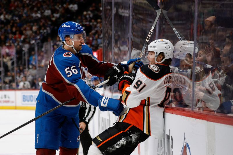 Dec 5, 2023; Denver, Colorado, USA; Colorado Avalanche defenseman Kurtis MacDermid (56) and Anaheim Ducks center Leo Carlsson (91) get tangled up in the third period at Ball Arena. Mandatory Credit: Isaiah J. Downing-USA TODAY Sports