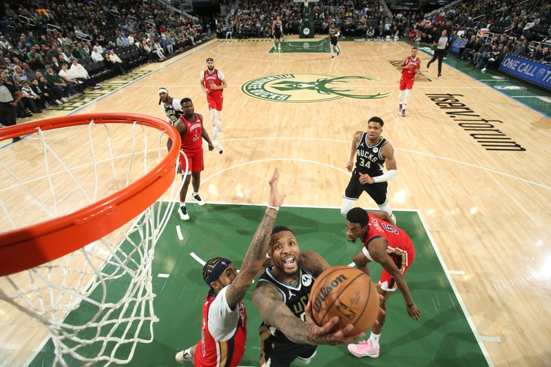 MILWAUKEE, WI - JANUARY 27:  Damian Lillard #0 of the Milwaukee Bucks goes to the basket during the game on January 27, 2024 at the Fiserv Forum Center in Milwaukee, Wisconsin. NOTE TO USER: User expressly acknowledges and agrees that, by downloading and or using this Photograph, user is consenting to the terms and conditions of the Getty Images License Agreement. Mandatory Copyright Notice: Copyright 2024 NBAE (Photo by Gary Dineen/NBAE via Getty Images).