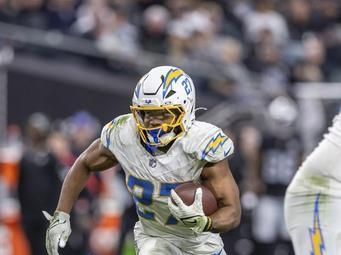 Los Angeles Chargers running back J.K. Dobbins (27) runs the ball against the Las Vegas Raiders in an NFL football game, Sunday, Jan. 5, 2025, in Las Vegas. Chargers defeated the Raiders 34-20. (AP Photo/Jeff Lewis)