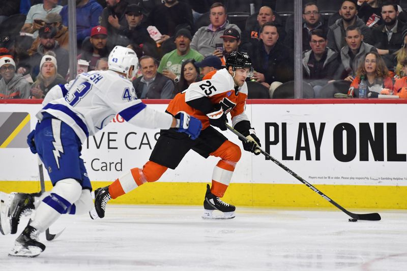 Feb 27, 2024; Philadelphia, Pennsylvania, USA; Philadelphia Flyers center Ryan Poehling (25) carries the puck past Tampa Bay Lightning defenseman Darren Raddysh (43) during the first period at Wells Fargo Center. Mandatory Credit: Eric Hartline-USA TODAY Sports