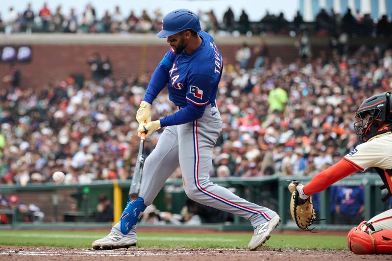 Apr 27, 2025; San Francisco, California, USA; Texas Rangers outfielder Leody Taveras (3) hits a double against the San Francisco Giants during the fifth inning at Oracle Park. Mandatory Credit: Robert Edwards-Imagn Images