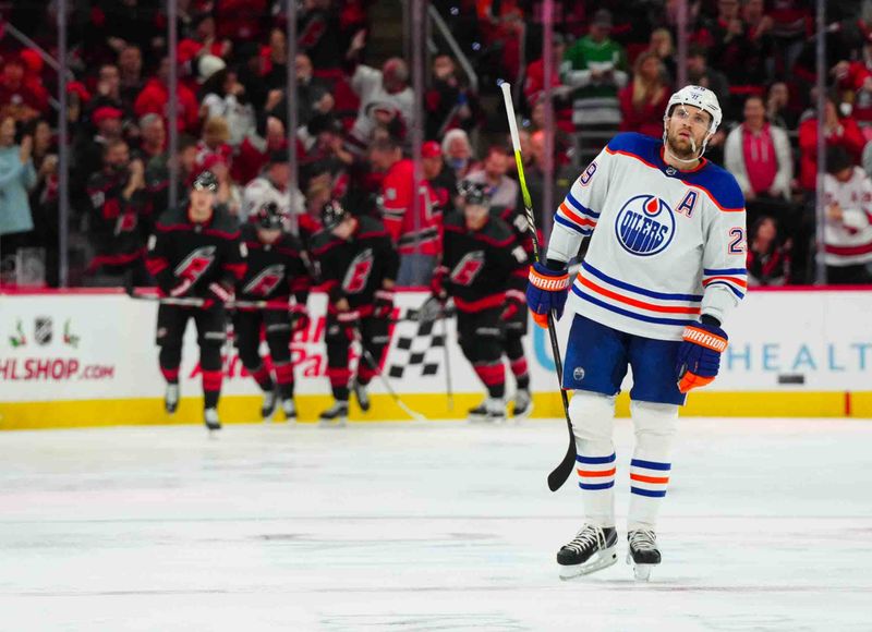 Nov 22, 2023; Raleigh, North Carolina, USA; Edmonton Oilers center Leon Draisaitl (29) looks on after Carolina Hurricanes center Martin Necas (88) goal during the second period at PNC Arena. Mandatory Credit: James Guillory-USA TODAY Sports