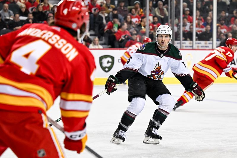 Jan 16, 2024; Calgary, Alberta, CAN; Arizona Coyotes center Alex Kerfoot (15) skates against the Calgary Flames during the first period at Scotiabank Saddledome. Mandatory Credit: Brett Holmes-USA TODAY Sports