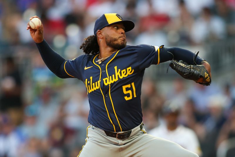 Aug 7, 2024; Atlanta, Georgia, USA; Milwaukee Brewers starting pitcher Freddy Peralta (51) throws against the Atlanta Braves in the second inning at Truist Park. Mandatory Credit: Brett Davis-USA TODAY Sports
