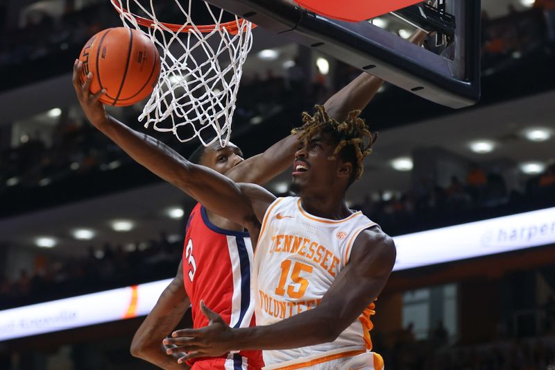 Jan 6, 2024; Knoxville, Tennessee, USA; Tennessee Volunteers guard Jahmai Mashack (15) goes to the basket against Mississippi Rebels forward Jamarion Sharp (3) during the first half at Thompson-Boling Arena at Food City Center. Mandatory Credit: Randy Sartin-USA TODAY Sports