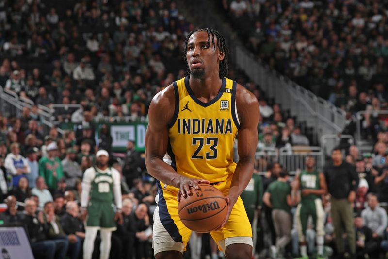 MILWAUKEE, WI - APRIL 21: Aaron Nesmith #23 of the Indiana Pacers shoots a free throw during the game against the Milwaukee Bucks during Round 1 Game 1 of the 2024 NBA Playoffs on April 21, 2024 at the Fiserv Forum Center in Milwaukee, Wisconsin. NOTE TO USER: User expressly acknowledges and agrees that, by downloading and or using this Photograph, user is consenting to the terms and conditions of the Getty Images License Agreement. Mandatory Copyright Notice: Copyright 2024 NBAE (Photo by Gary Dineen/NBAE via Getty Images).