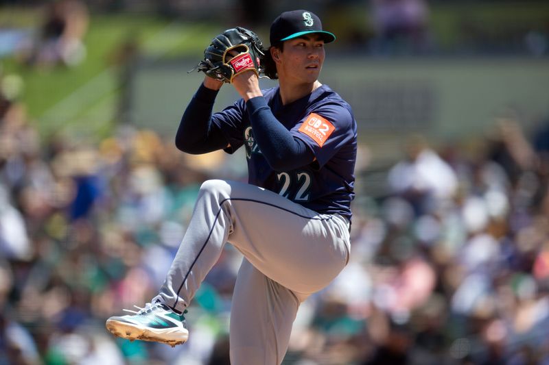 May 7, 2025; West Sacramento, California, USA; Seattle Mariners starting pitcher Bryan Woo (22) delivers a pitch against the Athletics during the second inning at Sutter Health Park. Mandatory Credit: D. Ross Cameron-Imagn Images 
