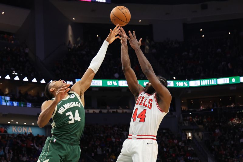 MILWAUKEE, WISCONSIN - DECEMBER 11: Patrick Williams #44 of the Chicago Bulls shoots over Giannis Antetokounmpo #34 of the Milwaukee Bucks during the first half of a game at Fiserv Forum on December 11, 2023 in Milwaukee, Wisconsin. NOTE TO USER: User expressly acknowledges and agrees that, by downloading and or using this photograph, User is consenting to the terms and conditions of the Getty Images License Agreement. (Photo by Stacy Revere/Getty Images)