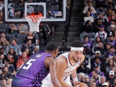 SACRAMENTO, CA - DECEMBER 22: Devin Booker #1 of the Phoenix Suns handles the ball during the game  on December 22, 2023 at Golden 1 Center in Sacramento, California. NOTE TO USER: User expressly acknowledges and agrees that, by downloading and or using this Photograph, user is consenting to the terms and conditions of the Getty Images License Agreement. Mandatory Copyright Notice: Copyright 2023 NBAE (Photo by Rocky Widner/NBAE via Getty Images)